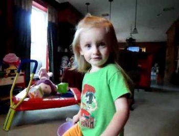 Toddler Watching the Mother Goose Club DVD