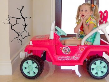 Stacy and Dad play outside with water toys.