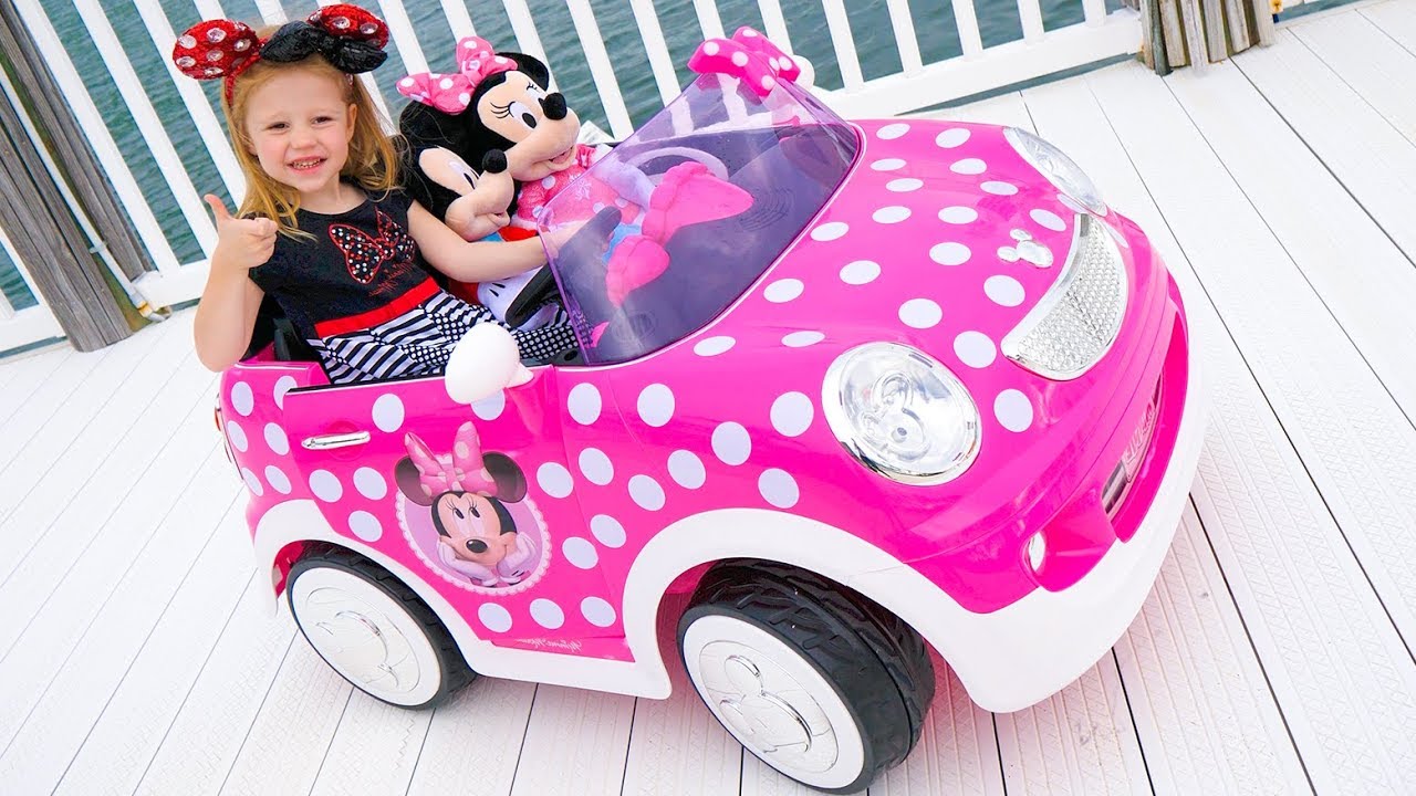 Stacy and the new children’s car ride on with a minnie mouse
