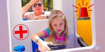 Stacy and dad have fun in the amusement park